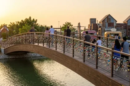 Promise Bridge Dubai at The Yard Al Khawaneej with love locks at sunset